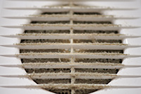 Dust accumulated on an air vent indicating it is time for duct service in Ocean County