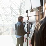 Reliable ITM service keeps branches moving towards the future like this bank of machines in a glass ceilinged building