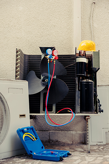 An open condenser; Monmouth County air conditioner repair in progress