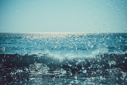 A view of the ocean with the appearance of salt and water droplets on the lens; Monmouth County air conditioner repair is different at the shore.